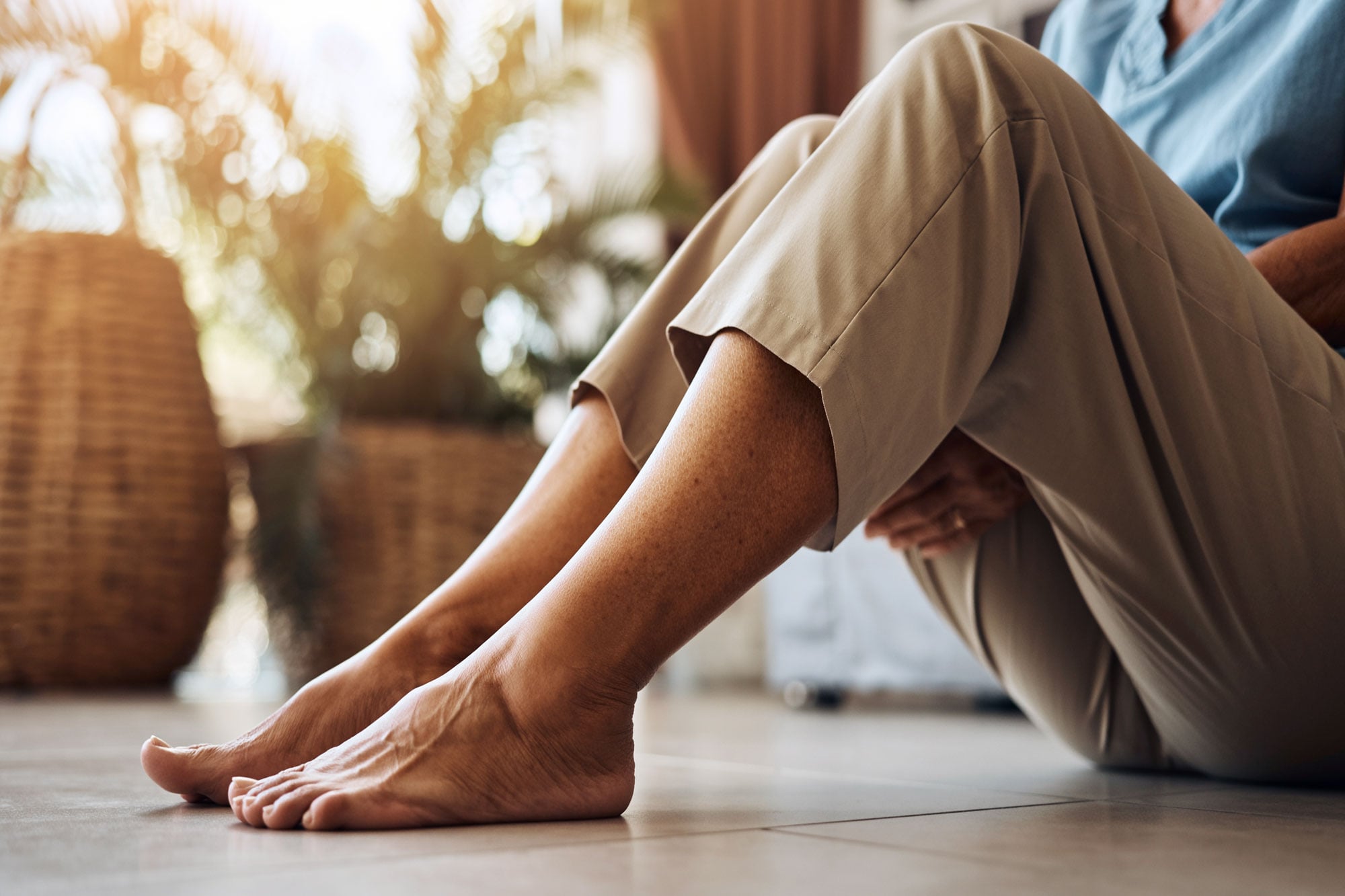 Seated person holding a lower leg