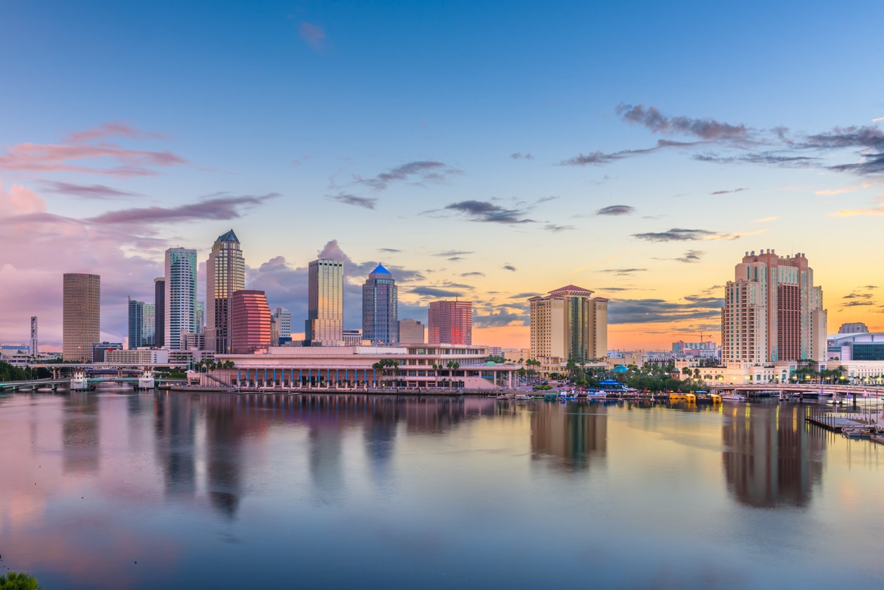 Photo of water and downtown city.